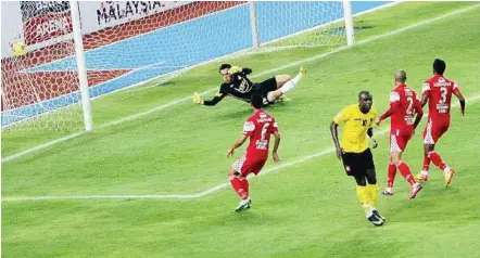  ??  ?? Well beaten: Negri’s Jean Emmanual Effa Owana celebratin­g after scoring against Kelantan during the Charity Shield match at National Stadium in Bukit Jalil on Saturday.