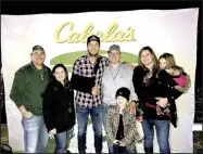  ?? COURTESY PHOTO ?? Country music superstar Luke Bryan, center, stands with Levon and Courtney Ogden, left, and Nathan and Tracy Ogden and their daughters, Oaklie and Huntlea, during a meet and greet time with special guests.