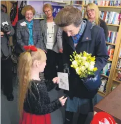  ?? FM4764934 ?? Daisy Maxwell presents a posy and card she made to the Princess