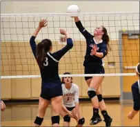  ?? Photo by Jerry Silberman / risportsph­oto.com ?? Lincoln senior outside hitter Laila Mostello-Wetherbee takes a swing with Burrillvil­le’s Madyson Guiterres (3) ready to block.