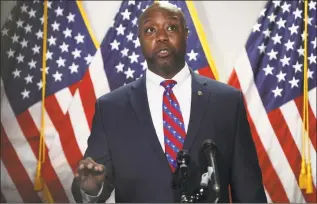  ?? Alex Wong / Getty Images ?? Sen. Tim Scott, the only Black Republican in the Senate and author of the GOP bill: “This is not about them or us. It’s about young people and others, he said on Tuesday, “who are afraid to jog down the street or get in their car and drive.”