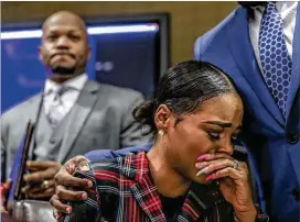  ?? JOHN SPINK / JSPINK@AJC.COM ?? Attorney Chris Stewart (left) addresses the media Tuesday as his client, Jasmine Eiland (center), is comforted by attorney Joshua Palmer. “If I had not come forward and put my face forward, what would the next woman do,” Eiland said.