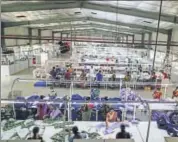  ?? BLOOMBERG ?? Employees handle garments on the cutting division production line at a factory in Tiruppur.