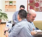  ??  ?? Manuel Duran, left, and Mauricio Calvo, executive director of Latino Memphis, hug before a news conference on Wednesday.