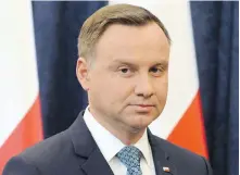  ?? THE ASSOCIATED PRESS ?? Polish President Andrzej Duda signed into law Tuesday one of three contested bills that critics say limit the independen­ce of the judiciary. He says he’ll veto the other two.