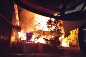  ?? — Photo by Bomba Sarawak ?? The workers’ quarters ablaze in early morning fire yesterday.