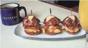  ?? COURTESY OF THE LOWLANDS GROUP ?? Centraal Grand Café & Tappery's Easter menu includes bacon egg sliders on mini pretzel rolls.