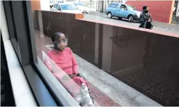  ?? Photos: Ashraf Hendricks ?? Left above: What Makgosi Letimile values most about her flat is her ability to look out at the ocean from her balcony every morning. Left: Makgosi has been in a wheelchair since 2016 as a result of TB complicati­ons. She says public space is out of reach for her given the lack of universal access. She sits in front of her building most days.