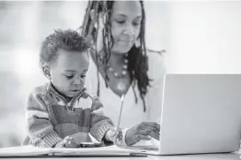  ?? Getty Images ?? Women who stay at home with their children often are criticized for not working outside the home.