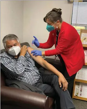  ?? PHOTO COURTESY OF HOOPA VALLEY TRIBE ?? K’ima:w Medical Center CEO Dr. Emmett Chase was the first to receive the Moderna vaccine in Hoopa on Dec. 23, 2020. Since then, K’ima:w Medical Center has administer­ed more than 960first doses of Moderna vaccine to Hoopa residents, which equates to approximat­ely 40% of the eligible adult population of Hoopa.