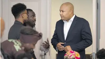  ?? DAX MELMER ?? Those who attended a meeting about the Ontario Black Youth Action Plan got the chance to speak with Michael Coteau, right, minister of children and youth services and minister responsibl­e for anti-racism.