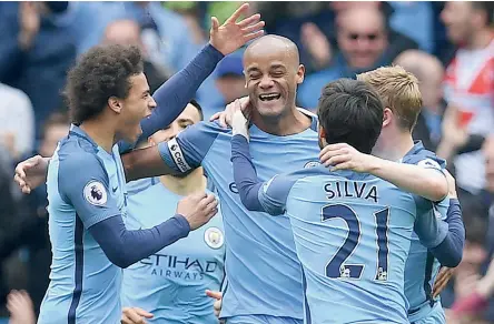  ??  ?? Manchester City’s Kevin de Bruyne (centre) scores in their English Premier League match against Crystal Palace at the Etihad Stadium on Saturday. Manchester City won 5-0.