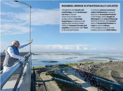  ?? PTI ?? prime Minister narendra Modi waves at people from the bogibeel bridge, the longest rail-cum-road bridge on the brahmaputr­a river in dibrugarh on Tuesday. —