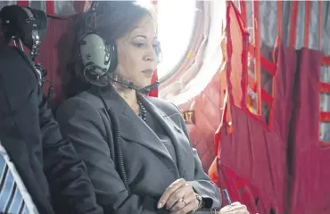  ?? PICTURE: SAUL LOEB / AFP ?? Kamala Harris reviews paperwork as she travels on Army Two helicopter