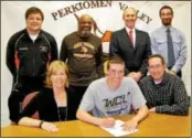  ?? Photo courtesy Perkiomen Valley High School ?? Ryan Heimbach signs his letter of intent to attend West Chester University. He is joined by his parents (seated) Robert and Jennean Heimbach. In the back row, from left, are Perk Valley head coach Joe Petsko and assistants Ron Livers, Ben Giess and Tom...