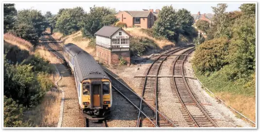  ??  ?? Poulton No 3 was the last of five SBs opened when the station was re-sited in 1896. With the tail lights clearly displayed, 156425 leaves Poulton with 1055 Manchester Airport-Blackpool North. The route to the right was the former main line to Fleetwood. When this photo was taken on August 21 2000, it was still in use as far as Burn Naze. Note the trap points on both branch line tracks to derail any possible runaway wagons. To the left of the Class 156 is the track bed of the former Fast Lines, which were removed in 1973.