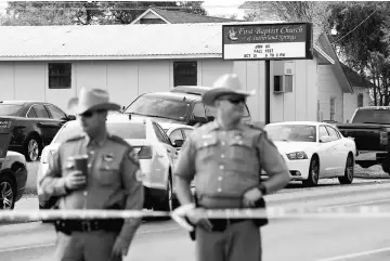  ??  ?? Law enforcemen­t officers guard the site of the shooting at the First Baptist Church of Sutherland Springs, Texas, US. — Reuters photo