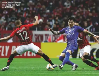  ??  ?? Threat...Urawa’s Fabricio tries to stop Jang Hyunsoo of Al Hilal