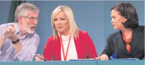  ??  ?? Sinn Fein’s top table at the ard fheis, Gerry Adams, Michelle O’Neill and Mary Lou McDonald