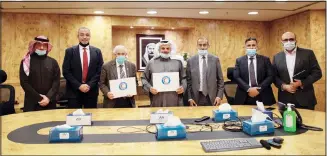  ??  ?? AAW Chairman and CEO Faisal Al Mutawa and Dr Hilal Al-Sayer with a delegation from Hoffmann-La Roche during the signing of the cooperatio­n agreement between Ali Abdul-Wahab Al-Mutawa Commercial Company and Kuwait Red Crescent Society.