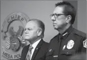  ??  ?? MESA POLICE CHIEF RAMON BATISTA (RIGHT) waits to speak Friday at police headquarte­rs. Batista announced his upcoming review into the department’s policies and training amid a second investigat­ion into officers’ use of force, this time against a...