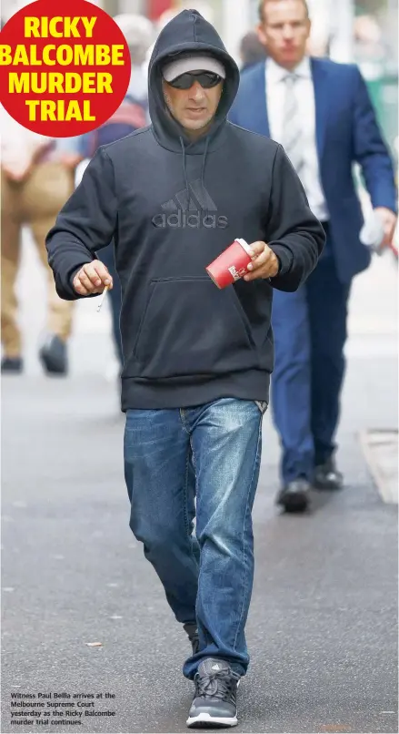  ??  ?? Witness Paul Bellia arrives at the Melbourne Supreme Court yesterday as the Ricky Balcombe murder trial continues.