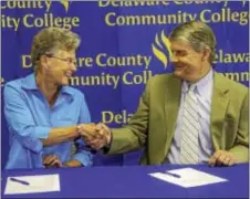  ?? SUBMITTED PHOTO ?? Dr. Kristin Woolever, Penn State Brandywine chancellor, and Dr. Jerry Parker, president of Delaware County Community College, are pictured at the guaranteed
admission agreement signing ceremony held at the Delaware County Community College Marple...