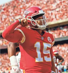  ?? JAY BIGGERSTAF­F/USA TODAY SPORTS ?? Chiefs quarterbac­k Patrick Mahomes celebrates after scoring a touchdown against the Browns during the first half.