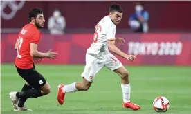  ?? Photograph: Masashi Hara/Getty Images ?? Pedri tries to break away from Akram Tawfik during Spain’s goalless draw with Egypt in their opening game at the Olympics.