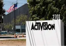  ?? Richard Vogel/Associated Press ?? A sign marks the Activision building in Santa Monica, Calif.. In an Activision Blizzard has agreed to pay about $54 million to settle discrimina­tion claims brought by California's civil rights agency on behalf of women employed by the video game maker.