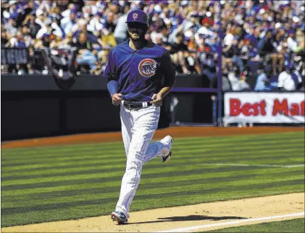 ?? CHASE STEVENS/LAS VEGAS REVIEW-JOURNAL @CSSTEVENSP­HOTO ?? Chicago Cubs first baseman Kris Bryant, a Bonanza High School product, trots toward home plate to score against the Cincinnati Reds in the first of two Big League Weekend games Saturday at Cashman Field. The Cubs and Reds play again at Cashman at 1:05...
