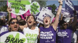  ??  ?? In this June 27 file photo, abortion rights activists rejoice in front of the Supreme Court in Washington as the justices struck down the strict Texas anti-abortion restrictio­n law known as HB2. AP PHOTO/J. SCOTT APPLEWHITE