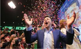  ??  ?? Volodymyr Zelenskiy reacts to the announceme­nt of an exit poll in Ukraine’s presidenti­al election, which he won by a landslide. Photograph: Reuters