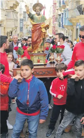  ??  ?? Children from Valletta and across the island celebrated a mini version of St Paul’s Feast in the streets of the capital yesterday. This colourful procession saw children cheering as they carried a small statue of St Paul, while the La Valette Band treated the crowds to various popular marches. The procession was preceded by a special Mass for children at the Church of St Paul’s Shipwreck. Photo: Carl Farrugia