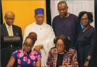  ?? ?? L-R: (Sitting in front) Mrs. Odunayo Sanya, Executive Director, MTN Foundation; Dr. Tinuola Akinbolagb­e, Managing Director/CEO, Private Sector Health Alliance of Nigeria (PSHAN); Standing L-R: Dennis Okoro, Director, MTN Foundation; Julius Adelusi-Adeluyi (OFR, mni), Chairman, MTN Foundation; Aigboje Aig-Imoukhuade, Director, PSHAN; Titilayo Fowokan, Director, PSHAN at the signing of the MoA