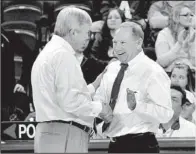  ?? NWA Media/MICHAEL WOODS ?? (right) shakes hands with Texas A&M Coach Gary Blair after the Aggies’ 63-51 victory over the Razorbacks on Sunday. Collen hopes his team can rebound after an 0-2 start in SEC play and make the NCAA Tournament again.