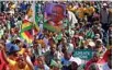  ?? — REUTERS/Philimon Bulawayo ?? REACHING OUT: Supporters of President Emmerson Mnangagwa gather at an election rally in Marondera, Zimbabwe, July 21, 2018.