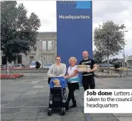  ??  ?? Job done Letters are taken to the council’s headquarte­rs