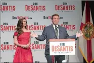  ?? PHELAN M. EBENHACK/AP PHOTO ?? Florida Republican gubernator­ial candidate Ron DeSantis speaks to supporters with his wife, Casey, after winning the Republican primary Tuesday in Orlando, Fla.