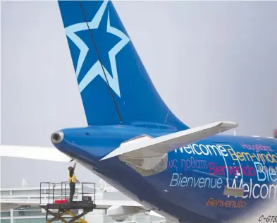  ?? BRENT LEWIN / BLOOMBERG FILES ?? Transat had some 65,000 customers abroad in sunny or European destinatio­ns as of last Wednesday
but that number was down significan­tly by Sunday as about 40,000 had returned to Canada.