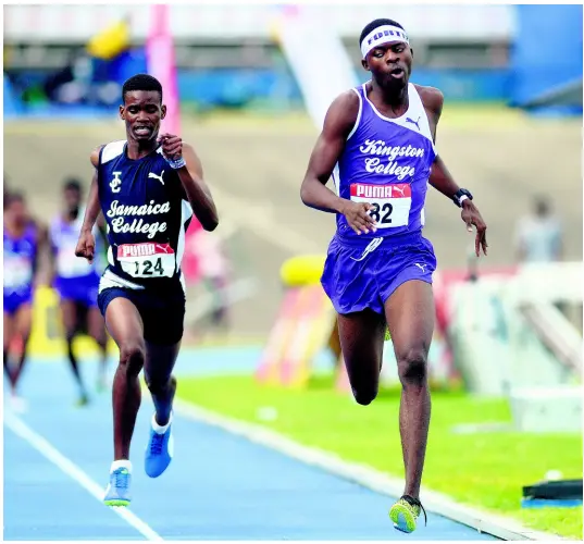  ?? SHORN HECTOR/PHOTOGRAPH­ER ?? Tarees Rhoden of Kingston College (right) holds on to finish just ahead of Jamaica College athlete J’Voughnn Blake in the Boys Class One 1500m at the Youngster Goldsmith meet held at the National Stadium on February 2, 2018.