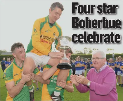  ?? Picture John Tarrant ?? Boherbue captain Kevin Murphy accepts the Castlecor Potatoes Duhallow Junior A Football Championsh­ip Cup from Joe Kearns, Chairman, Duhallow Junior Board.