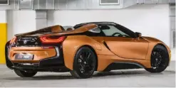  ??  ?? clockwise from top Outlandish looks set necks craning; Roadster weighs 104 kg more than the tin-top; black accenting highlights the rear’s intricate design; fully charged, BMW claims a range of 53 km.