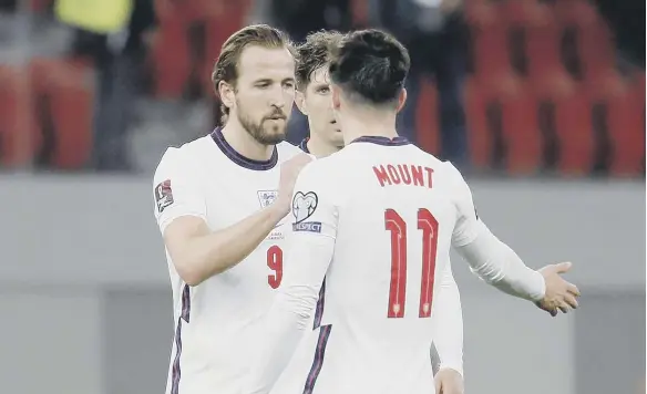  ??  ?? England’s Harry Kane and Mason Mount react after the final whistle during the FIFA 2022 World Cup qualifying match at the National Arena in Tirana, Albania.