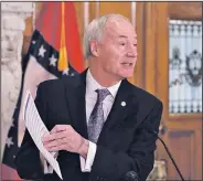  ?? Arkansas Democrat-Gazette/STATON BREIDENTHA­L ?? Gov. Asa Hutchinson talks Thursday at the state Capitol following the end of the Legislatur­e’s special session and after the announceme­nt of his plan to reduce the number of state agencies that report to his office.