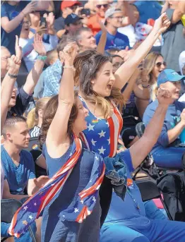  ?? GREG SORBER/JOURNAL ?? Michelle Andersen, left, and her daughter Talia El-Zaatari, both of Albuquerqu­e, cheer the first goal by the U.S. women’s soccer team while attending a World Cup watch party at Civic Plaza on Sunday. The U.S. beat the Netherland­s 2-0.