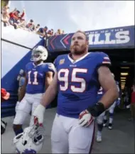  ?? ADRIAN KRAUS — THE ASSOCIATED PRESS FILE ?? In this Oct. 22 photo, Buffalo Bills defensive tackle Kyle Williams (95) and wide receiver Zay Jones (11) exit the tunnel prior to an NFL football game against the Tampa Bay Buccaneers, in Orchard Park, N.Y.