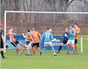  ??  ?? Early action in the Rothes goalmouth, with the side under pressure after a corner