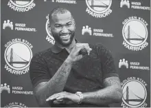  ?? BEN MARGOT THE ASSOCIATED PRESS ?? Golden State Warriors’ DeMarcus Cousins reacts during a media conference Thursday in Oakland, Calif.