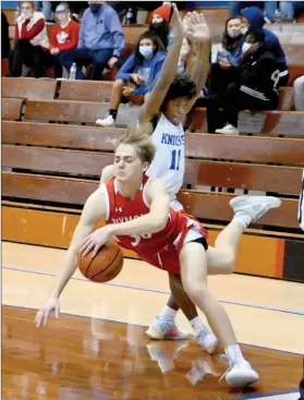  ?? PILOT PHOTO/MAGGIE NIXON ?? ABOVE: Plymouth’s Tanner Feece is fouled by Mishawaka Marian’s Davion Taylor.